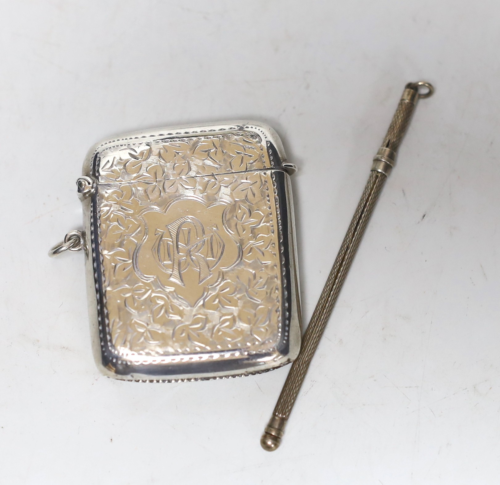 A George V silver Champagne coupe, Birmingham, 1923, 11.4cm with engraved inscription, a silver vesta case and a boxed swizzle stick.